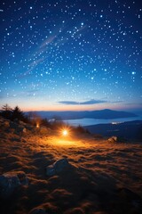 Starry night sky over mountain landscape
