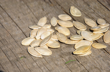 pumpkin seeds on wooden table
