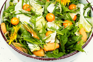 Green salad with physalis and field grass