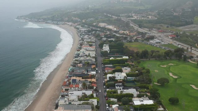 Establish shot of Malibu Los Angeles California on a cloudy day with fog