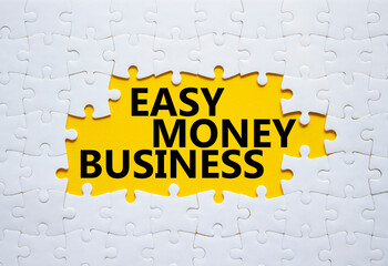 Easy Money Business symbol. Concept words Easy Money Business on white puzzle. Beautiful yellow...