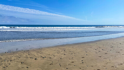 Waves roll onto the shore. Sea foam. Canary Islands sea view, Atlantic Ocean