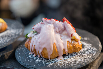 Strawberry croissant. White cheese and mint. breakfast.