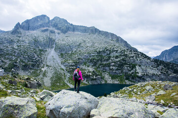 Young hiker woman in Vall de Boi, Aiguestortes and Sant Maurici National Park, Spain