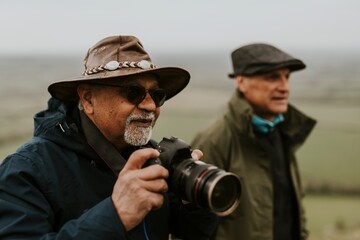 Senior nature photographers on mountain
