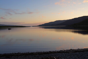 Fototapeta na wymiar Sunset over a calm Loch Beg on the Isle of Mull, Scotland, UK