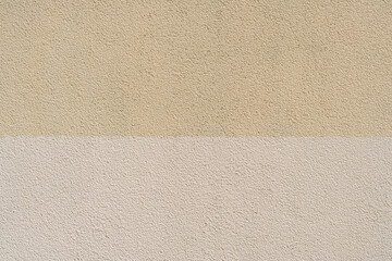 Texture of rough plaster half painted. Natural background.