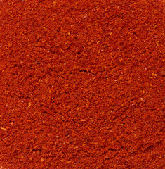 Texture of smoked ground red paprika, full frame