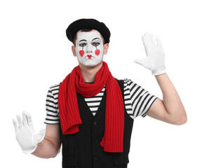 Funny mime artist in beret posing on white background