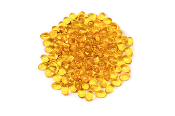 A group of yellow capsules isolated on a white background.