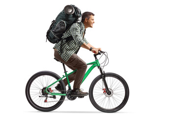 Full length profile shot of a man with a backpack riding a bicycle