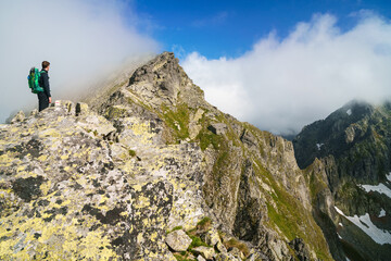 Fototapeta premium tourist on a trip in the High Tatras during summer days