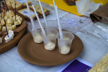 Cheese board with various types cheese and jam.