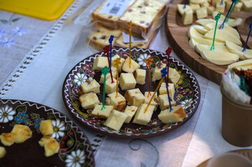 Cheese board with various types cheese and jam.