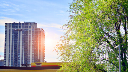 Modern residential building with new apartments in a green residential area. Eco architecture....