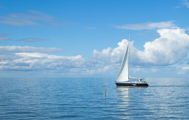 A sailboat on calm seas, 