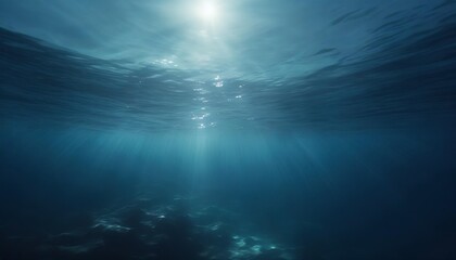 dark blue water of a deep sea with sun glare in the sky peaceful underwater landscape - obrazy, fototapety, plakaty