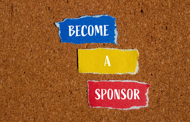 Become a sponsor words written on ripped paper pieces with brown background. Conceptual become a...