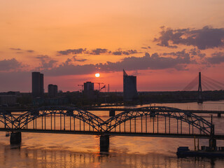 Magical aerial sunset over Riga old town, the capital of Latvia. Riga rooftop view panorama at...