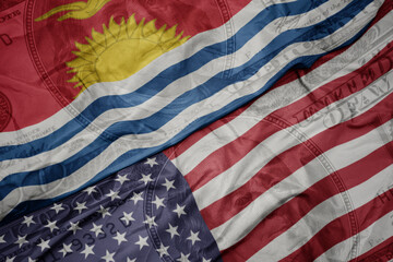 Obraz premium waving colorful flag of united states of america and national flag of Kiribati on the dollar money background. finance concept.