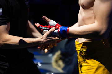 MMA glove on the fighter's hand during the referee's inspection before the fight
