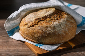 homemade whole grain bread in the kitchen on a wooden table 1