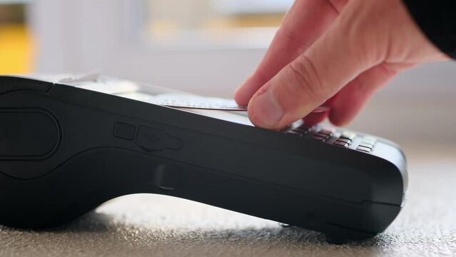 Contactless scanning of the credit card into the POS machine and entering the password