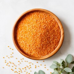 Red lentils on wooden plate, white background, flat lay, close up