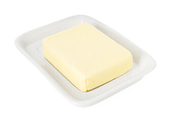 Dish with block of tasty butter isolated on white