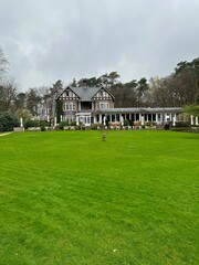 Luxury hotel, garden and green trees outdoors