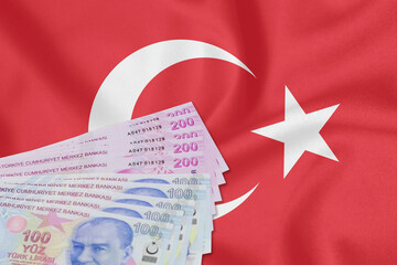 Close-up of Turkish Lira on Turkish Flag. Turkey's donation campaign