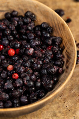 large number of frozen blueberries with red unripe