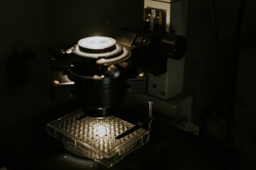 Laboratory's microscope and 96 well plate