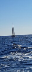 Obraz premium Yacht sailing on opened sea. Sailing boat. Yachting photo. Sailing photo. Yachting at windy day. Yacht. Sailboat. Sailing. Ship yachts with sails in the open Sea. Sailboat in the sea in the sunlight 