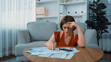 Stressed young woman has financial problems with credit card debt to pay prim from bad personal...