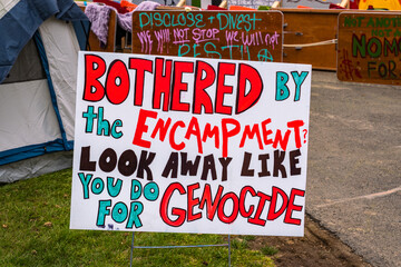Sign at Pro-Palestinian protesters at Tufts University set up a tent encampment to protest the war in Gaza.   