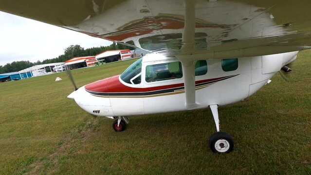 Small four-seater plane takes off into the sky. 