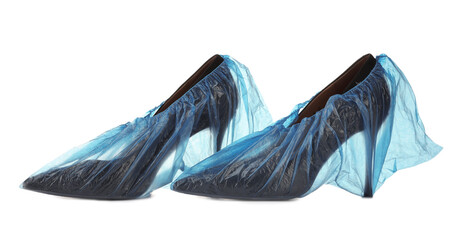High heels in shoe covers isolated on white