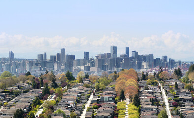 Vancouver skyline with the Burnaby Heights neighborhood in the foreground during a spring season in...
