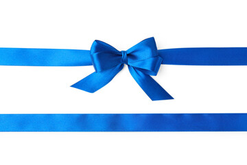 Blue satin ribbons with bow on white background, top view