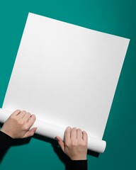 Blank white paper, held by hand, design space