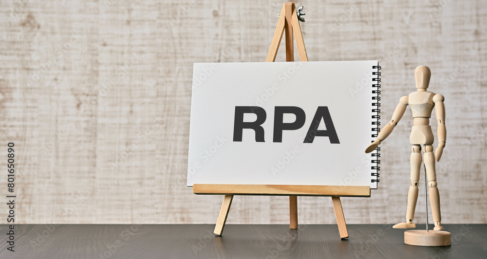 Poster there is notebook with the word rpa. it is an abbreviation for robotic process automation as eye-cat