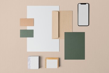 Green corporate identity, professional stationery, business branding, flat lay design