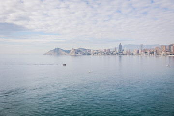 Benidorm,Alicante,Spain.Aerial photo from drone to Benidorm city skyline with beach and mountains in the background. December 6, 2022