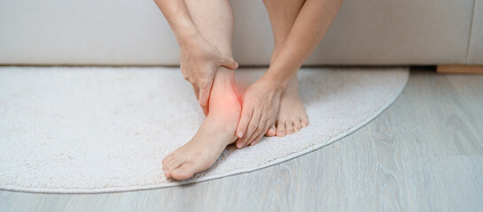 woman having leg pain due to Ankle Sprains or Achilles Tendonitis and Shin Splints ache. injuries, health and medical concept
