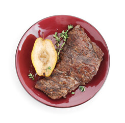 Delicious roasted beef meat, caramelized pear and thyme isolated on white, top view