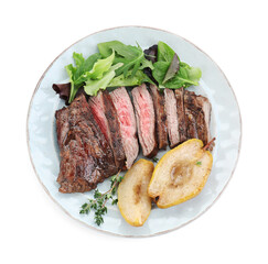 Pieces of delicious roasted beef meat, caramelized pear and greens isolated on white, top view
