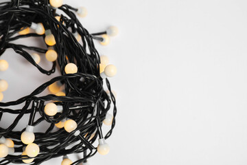 Beautiful Christmas lights on white background, top view