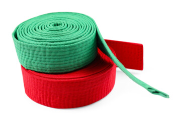 Green and red karate belts isolated on white