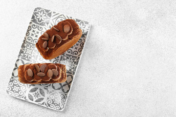 Tasty puff pastry. Supreme croissants with chocolate chips and cream on grey table, top view. Space for text